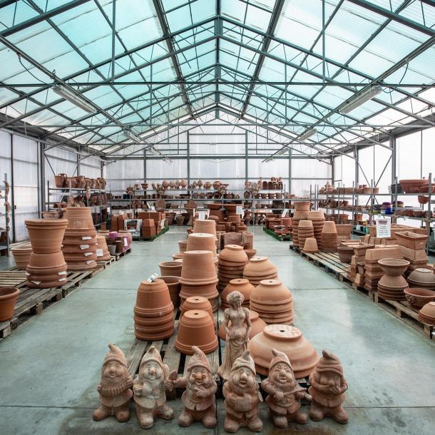Handmade and other terracotta vases, ceramic potholders